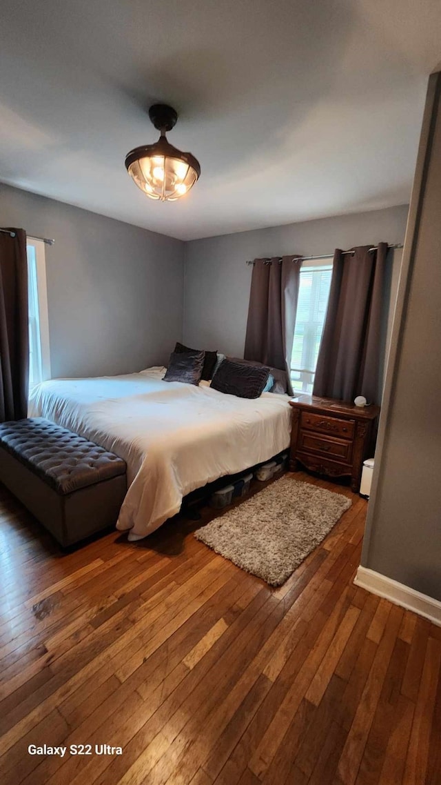 bedroom with wood-type flooring
