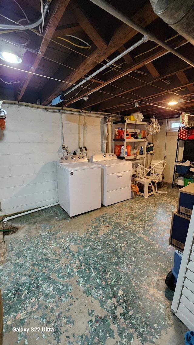 unfinished basement with washing machine and dryer