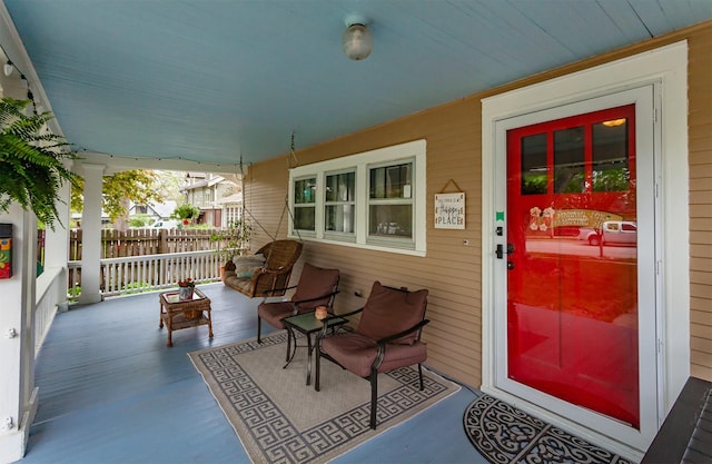 property entrance with covered porch