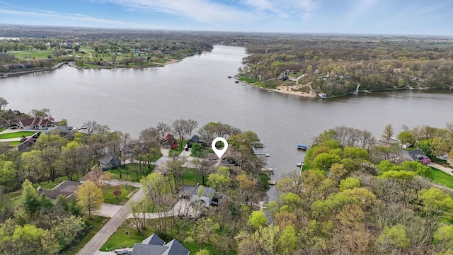 4715 Johnson Pt, Panora, IA 50216 - aerial perspective of suburban area with a nearby body of water and a heavily wooded area