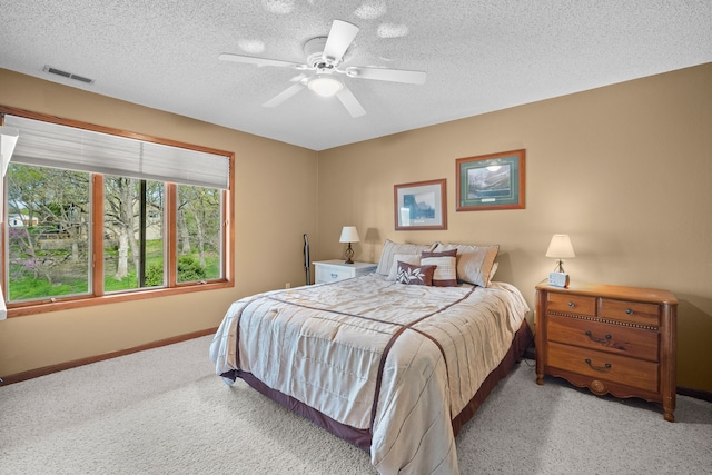 4715 Johnson Pt, Panora, IA 50216 - bedroom with baseboards, a textured ceiling, carpet floors, and visible vents