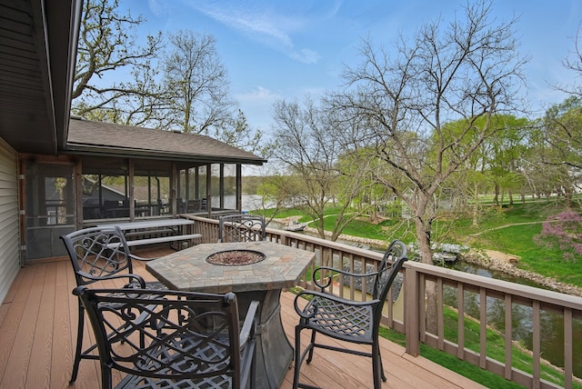 4715 Johnson Pt, Panora, IA 50216 - wooden deck with a water view, a sunroom, and an outdoor fire pit