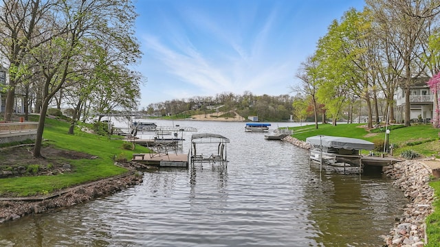 4715 Johnson Pt, Panora, IA 50216 - dock area featuring a water view and a lawn
