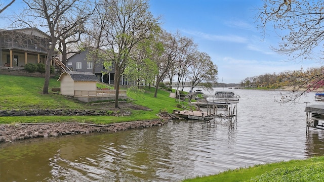 4715 Johnson Pt, Panora, IA 50216 - dock area with a water view and a lawn