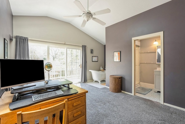 carpeted home office featuring vaulted ceiling, baseboards, and a ceiling fan
