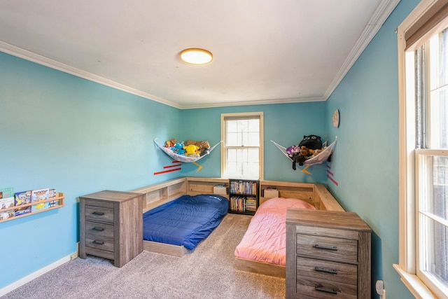 bedroom featuring crown molding and carpet