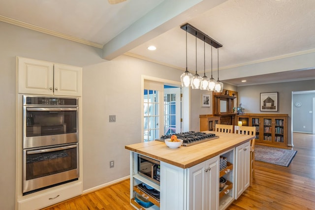 kitchen featuring white cabinets, open shelves, light wood finished floors, stainless steel appliances, and butcher block counters