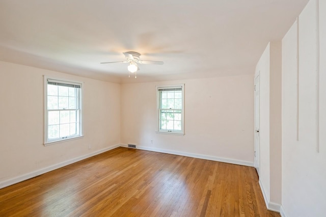 348 49th St, Des Moines, IA 50312 - empty room with ceiling fan and light wood-style floors