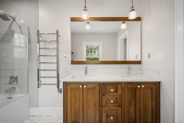 full bath featuring a sink, shower / bathing tub combination, and double vanity