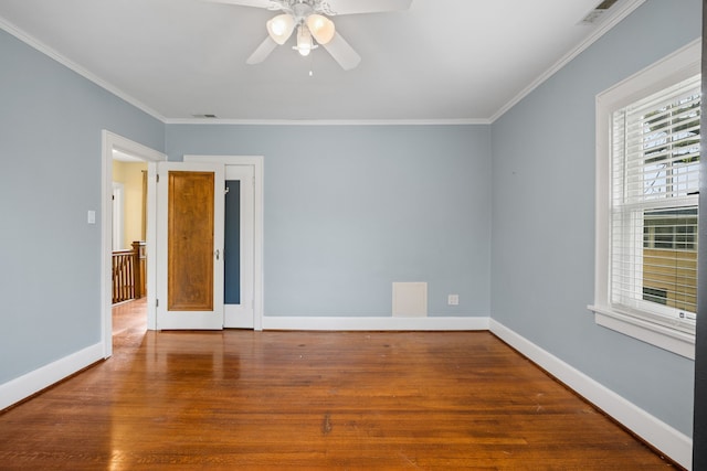 unfurnished room featuring ceiling fan, ornamental molding, and wood finished floors