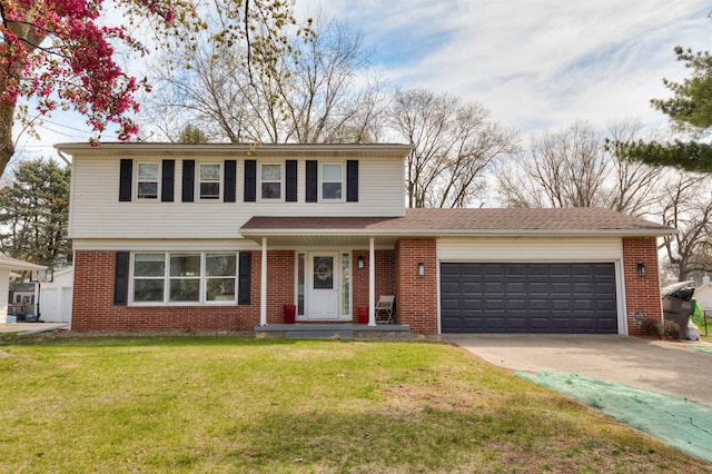 traditional-style house with a garage, a front yard, driveway, and brick siding