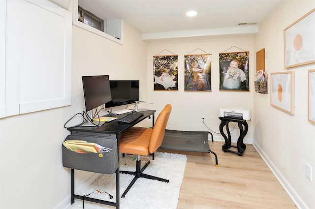 home office with recessed lighting, baseboards, visible vents, and light wood-style floors