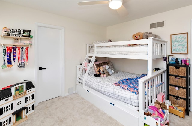 carpeted bedroom featuring visible vents and ceiling fan