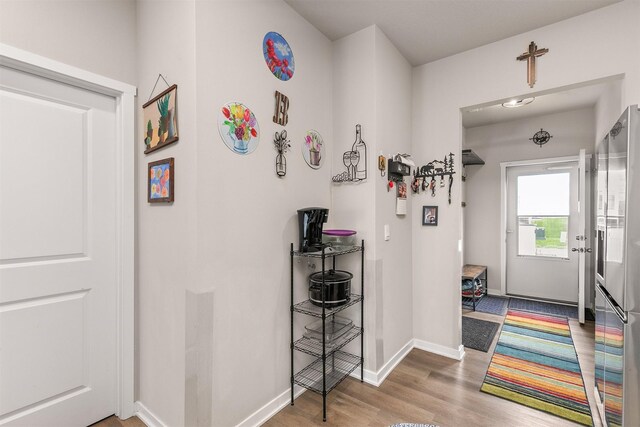 2601 NW 30th Ln, Ankeny, IA 50023 - corridor with baseboards and wood finished floors