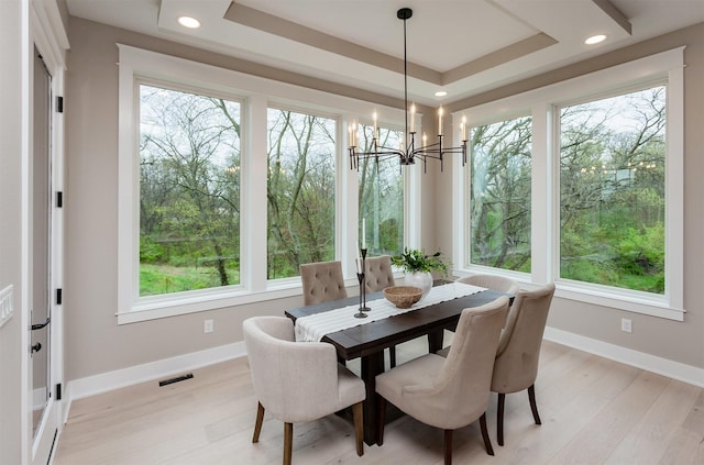 dining room with visible vents, a notable chandelier, and a healthy amount of sunlight