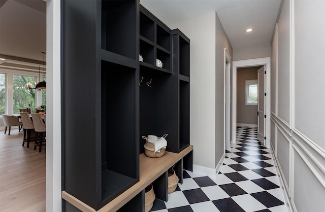 mudroom with light floors, plenty of natural light, baseboards, and recessed lighting