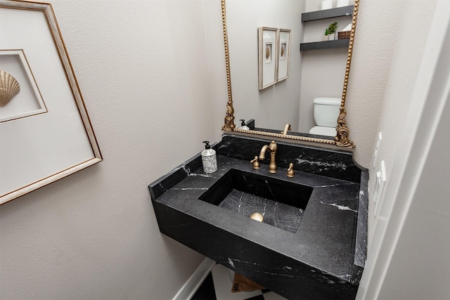 half bathroom featuring toilet