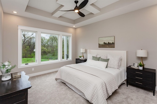 bedroom featuring ceiling fan, light carpet, recessed lighting, baseboards, and a tray ceiling