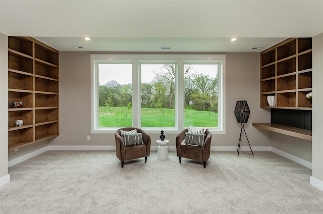 sitting room with recessed lighting, baseboards, visible vents, and carpet