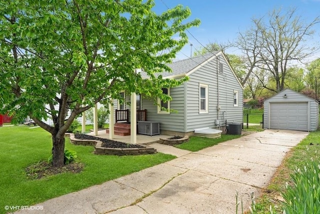 view of home's exterior with a garage, concrete driveway, cooling unit, an outdoor structure, and a yard