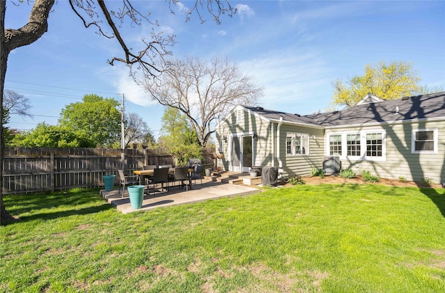 view of yard with entry steps, fence, and a patio area
