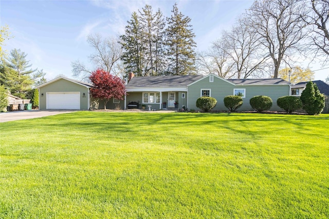 ranch-style house with a garage, a front lawn, a chimney, and concrete driveway