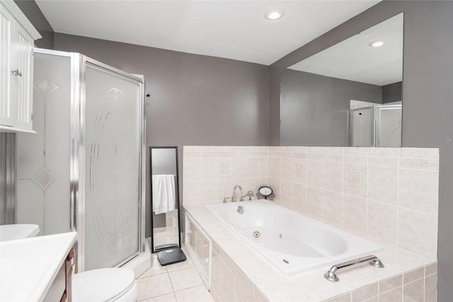 full bath with vanity, toilet, a whirlpool tub, tile patterned floors, and a shower stall