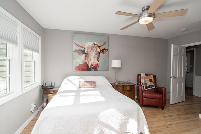 bedroom featuring a ceiling fan and light wood-style flooring