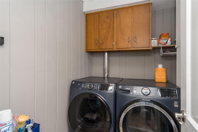 laundry room with cabinet space and washing machine and dryer