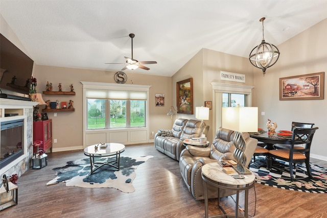 2006 NE 16th St, Ankeny, IA 50021 - living area featuring ceiling fan with notable chandelier, vaulted ceiling, and wood finished floors