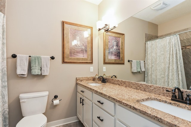 2006 NE 16th St, Ankeny, IA 50021 - full bathroom featuring a sink, toilet, double vanity, and visible vents