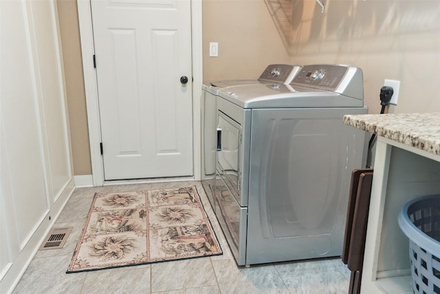 2006 NE 16th St, Ankeny, IA 50021 - laundry room with laundry area, washing machine and dryer, and visible vents