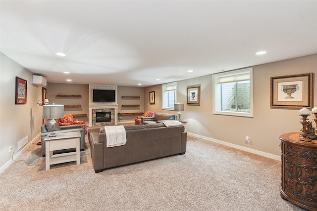 2006 NE 16th St, Ankeny, IA 50021 - living area with visible vents, a wall mounted AC, a fireplace, carpet, and recessed lighting