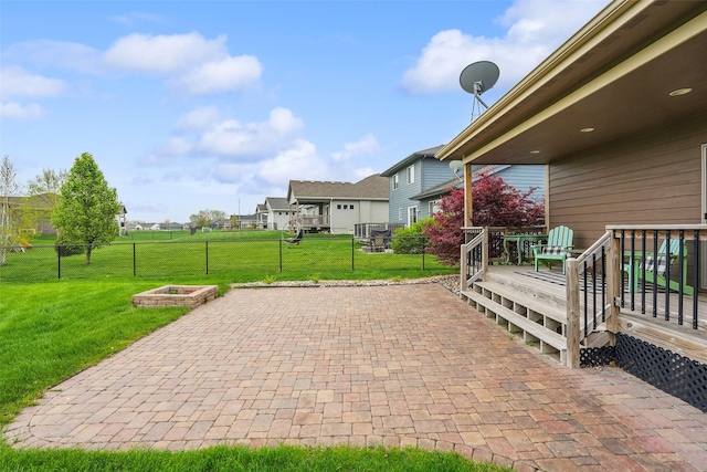 2006 NE 16th St, Ankeny, IA 50021 - view of patio / terrace with a fire pit, fence, and a deck