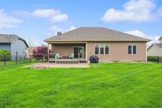 2006 NE 16th St, Ankeny, IA 50021 - rear view of house featuring fence, a yard, and a patio area