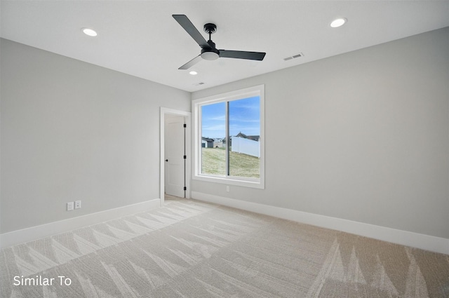 7325 NW Beaver Dr, Johnston, IA 50131 - unfurnished room featuring visible vents, a ceiling fan, baseboards, and light colored carpet