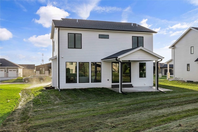 back of house with a lawn and a patio area