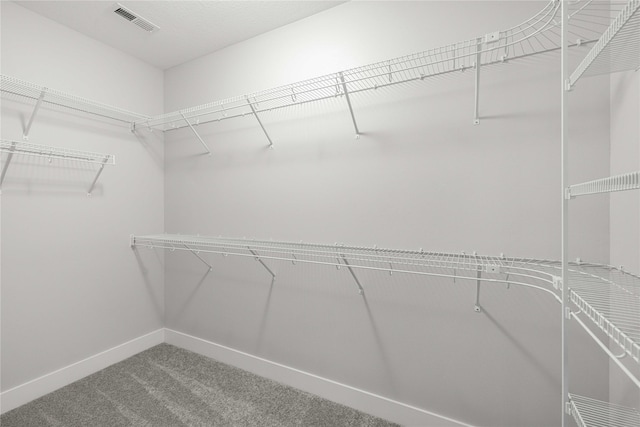walk in closet with carpet flooring and visible vents