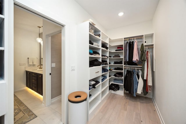 spacious closet featuring a sink