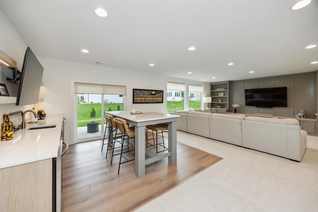 dining space featuring recessed lighting and light wood-style flooring