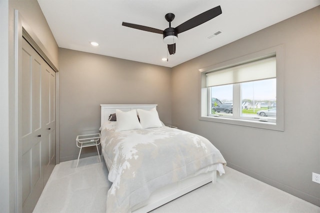 carpeted bedroom featuring recessed lighting, baseboards, a ceiling fan, visible vents, and a closet