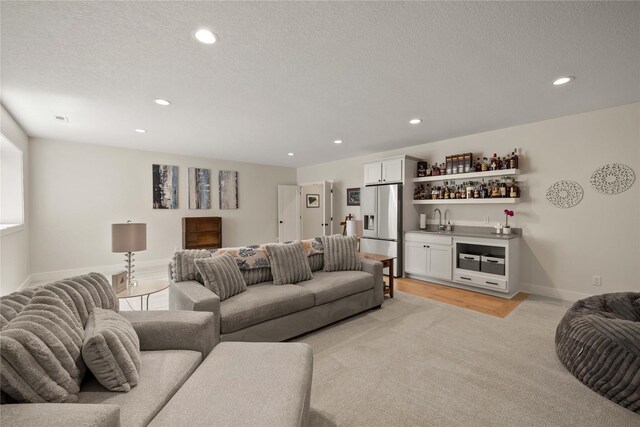 3319 NE 8th St, Ankeny, IA 50021 - living area featuring baseboards, indoor wet bar, and recessed lighting