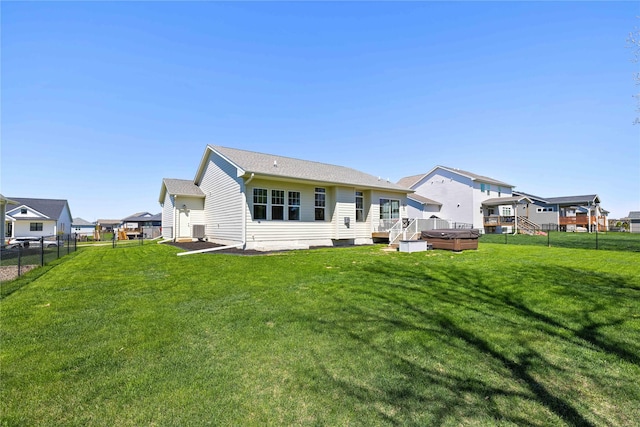 3319 NE 8th St, Ankeny, IA 50021 - rear view of property with a hot tub, fence, a residential view, and a deck