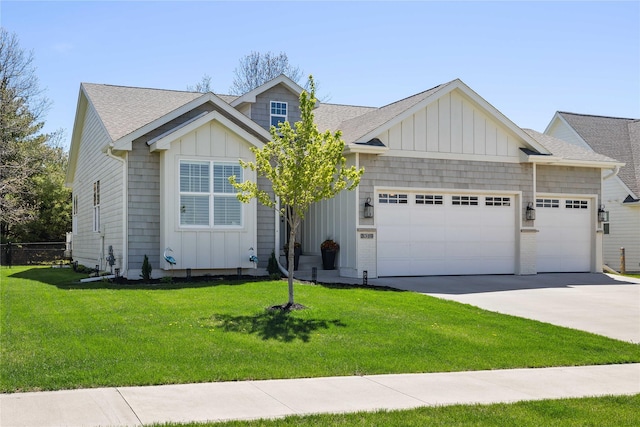 3319 NE 8th St, Ankeny, IA 50021 - view of front of house featuring a garage, a front yard, roof with shingles, board and batten siding, and driveway