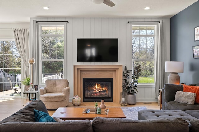 3319 NE 8th St, Ankeny, IA 50021 - living room with a glass covered fireplace, plenty of natural light, recessed lighting, and wood finished floors