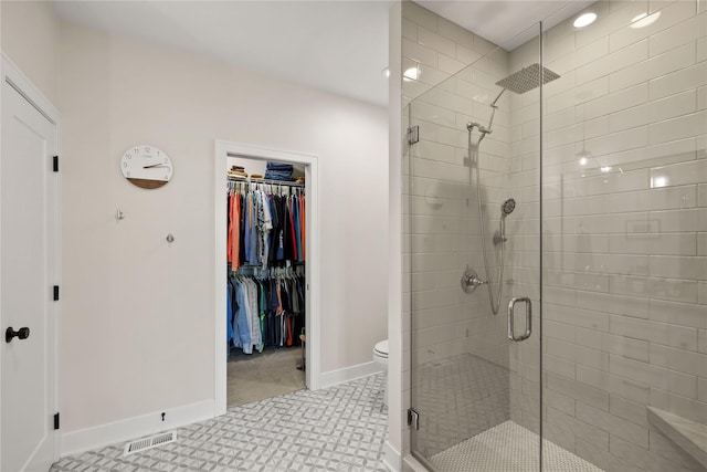 3319 NE 8th St, Ankeny, IA 50021 - full bathroom featuring toilet, baseboards, a spacious closet, visible vents, and a stall shower