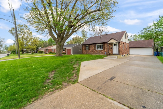 single story home featuring a front yard, roof with shingles, brick siding, an outbuilding, and a detached garage