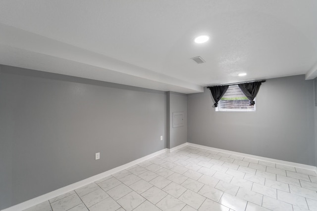 below grade area featuring recessed lighting, baseboards, and visible vents