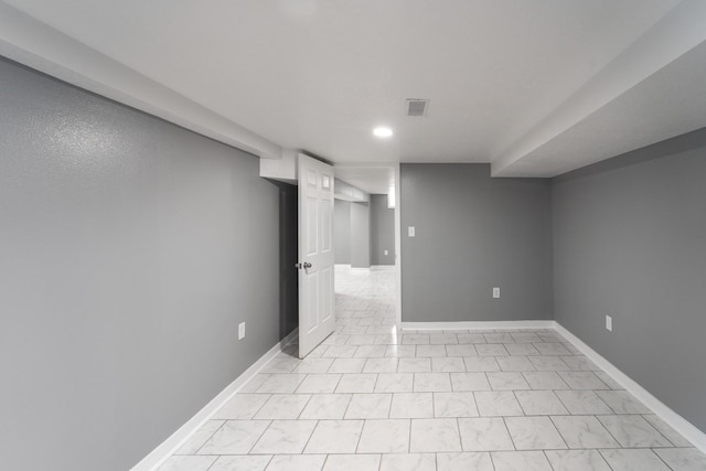 finished basement featuring baseboards, recessed lighting, and visible vents