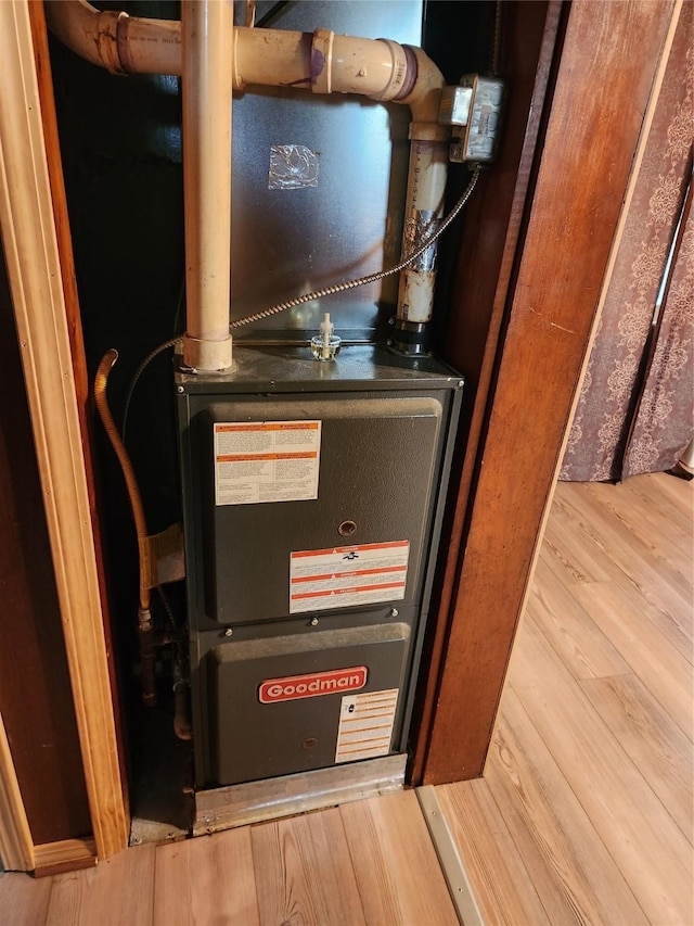 709 S Streeter St, Knoxville, IA 50138 - utility room with heating unit